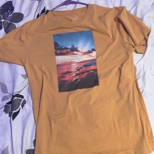 Orangish brown tee not sure what brand this is but I just got it a month ago.